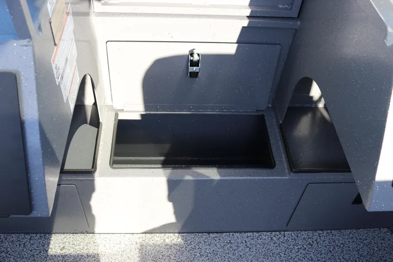 Slide: The Image of Interior storage compartment of 2026 Alumaweld Stryker 220 boat, featuring durable construction. - 18