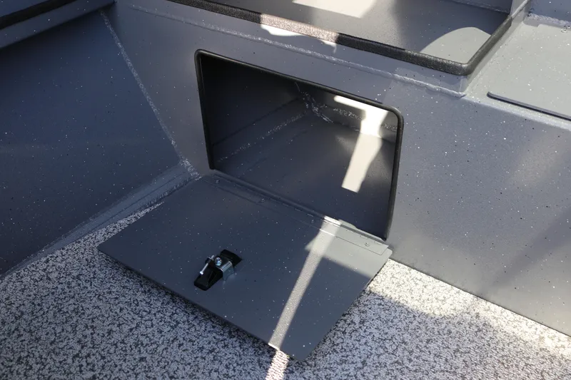 Slide: The Image of Storage compartment in 2026 Alumaweld Stryker 220 boat, featuring a secure latch. - 19