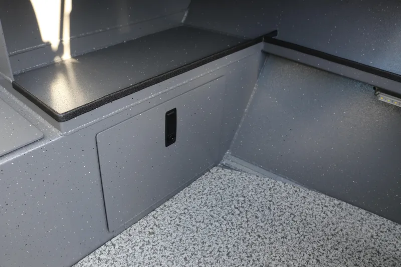 Slide: The Image of 2026 Alumaweld Stryker 220 interior storage compartment with speckled finish. - 22