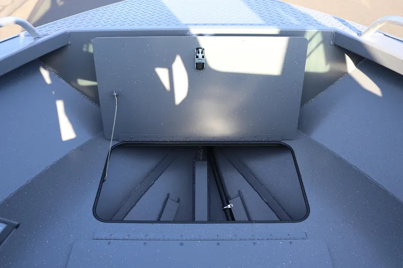 Slide: The Image of 2026 Alumaweld Stryker 220 boat storage compartment, open hatch view. - 26