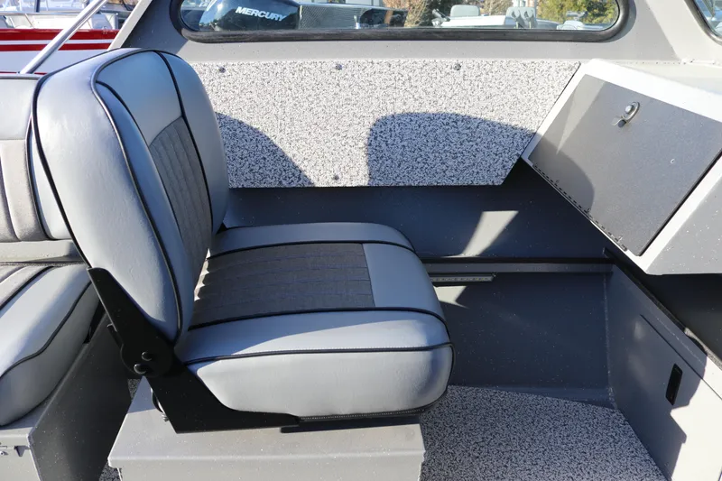 Slide: The Image of 2026 Alumaweld Stryker 220 boat interior with gray seating and storage compartment. - 30