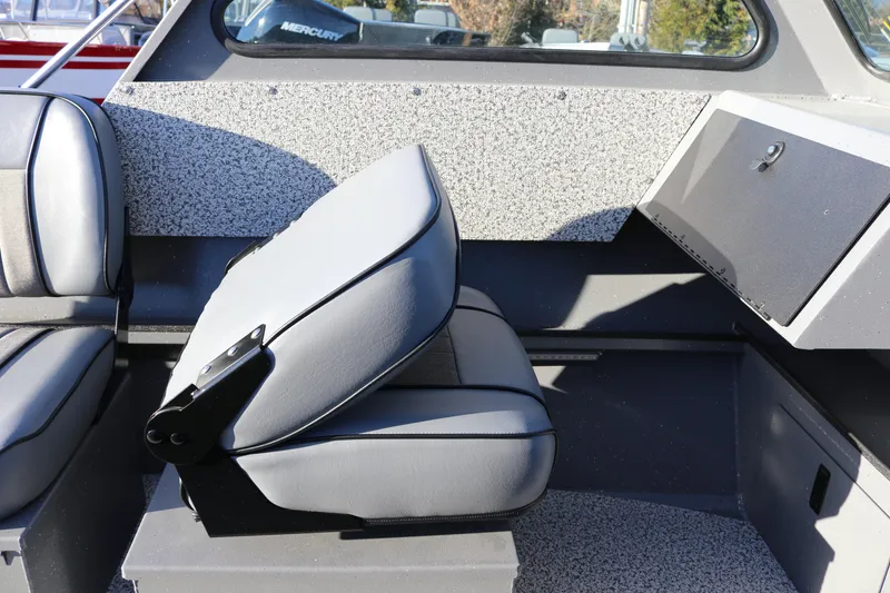 Slide: The Image of Interior of 2026 Alumaweld Stryker 220 boat with gray seating and storage compartment. - 31