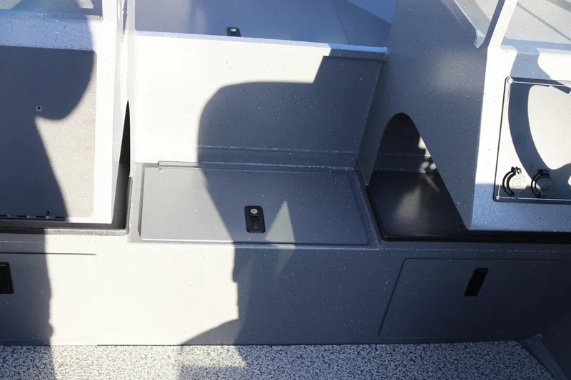 Slide: The Image of Interior view of 2026 Alumaweld Stryker 220 boat with storage compartments. - 32