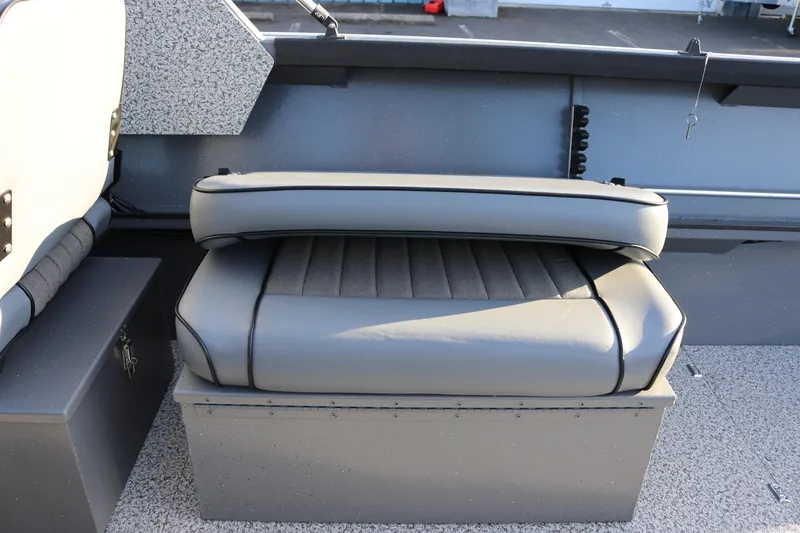 Slide: The Image of Gray cushioned seat on 2026 Alumaweld Stryker 220 boat, featuring durable design and storage. - 37