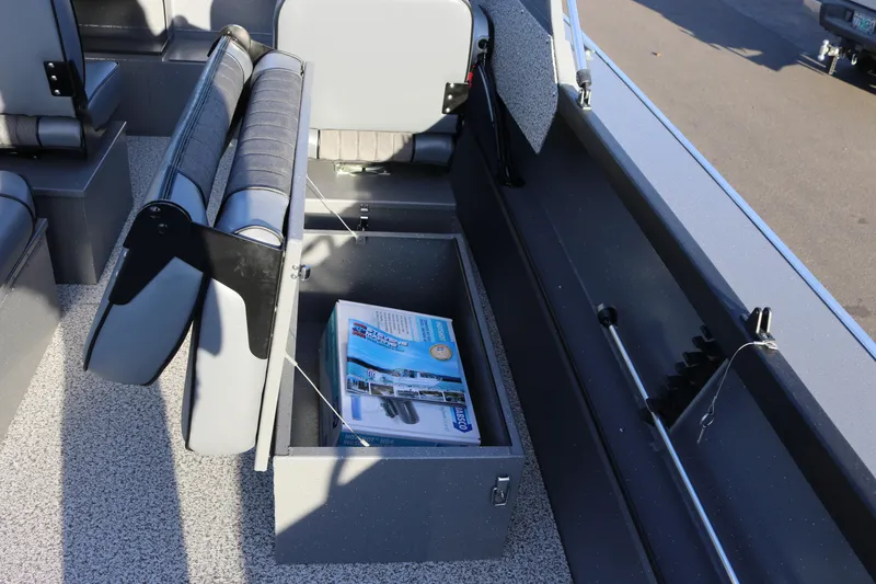 Slide: The Image of 2026 Alumaweld Stryker 220 boat interior with open storage compartment and seating. - 38