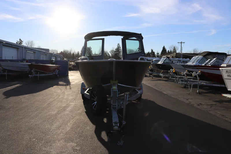 Slide: The Image of 2026 Alumaweld Stryker 220 boat on trailer in sunny outdoor lot. - 6
