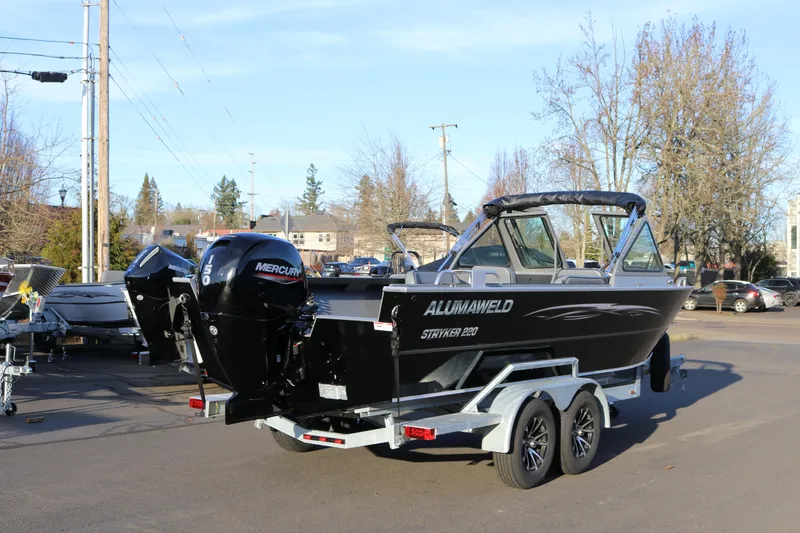 Slide: The Image of 2026 Alumaweld Stryker 220 boat on trailer with Mercury outboard motor. - 7