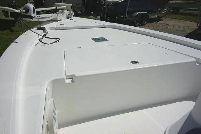 Slide: The Image of 2005 Century 2201 Bay Boat deck view with storage compartments and trolling motor. - 11