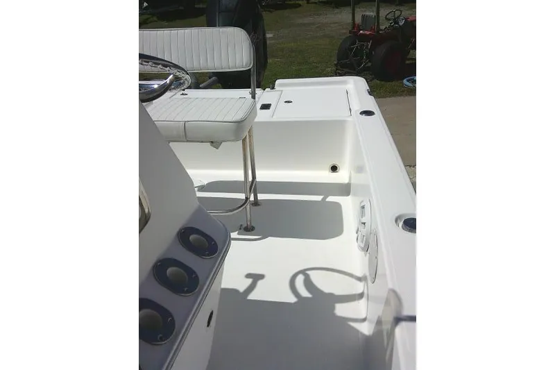 Slide: The Image of 2005 Century 2201 Bay Boat interior with seating and steering wheel. - 16