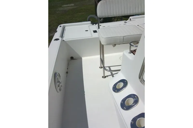 Slide: The Image of 2005 Century 2201 Bay Boat interior with seating and rod holders. - 17