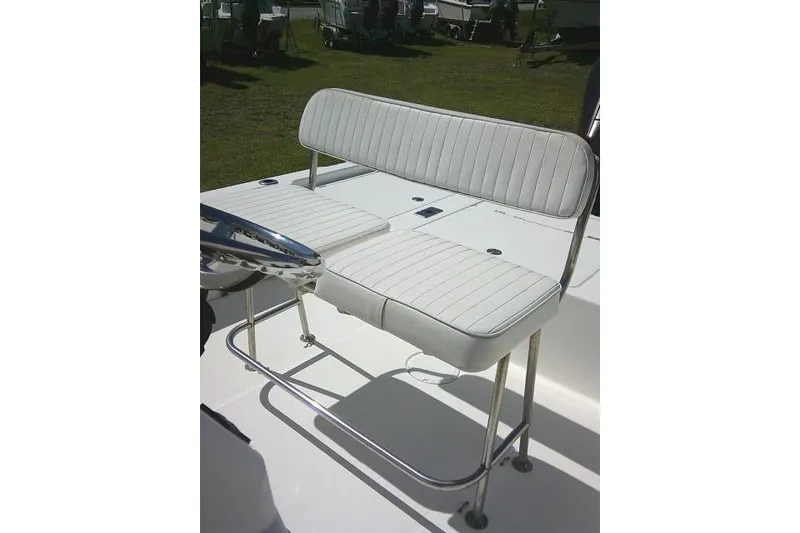 Slide: The Image of White cushioned seating on 2005 Century 2201 Bay Boat, featuring sleek metal frame design. - 19