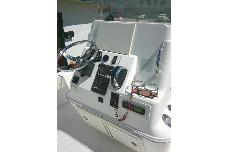 Slide: The Image of Century 2201 Bay Boat 2005 dashboard with steering wheel and controls. - 23
