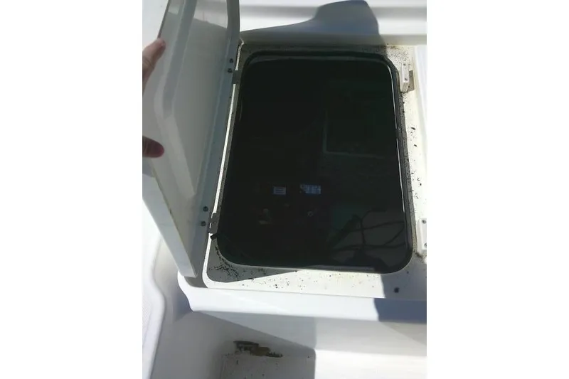Slide: The Image of Open storage compartment on a 2005 Century 2201 Bay Boat. - 25