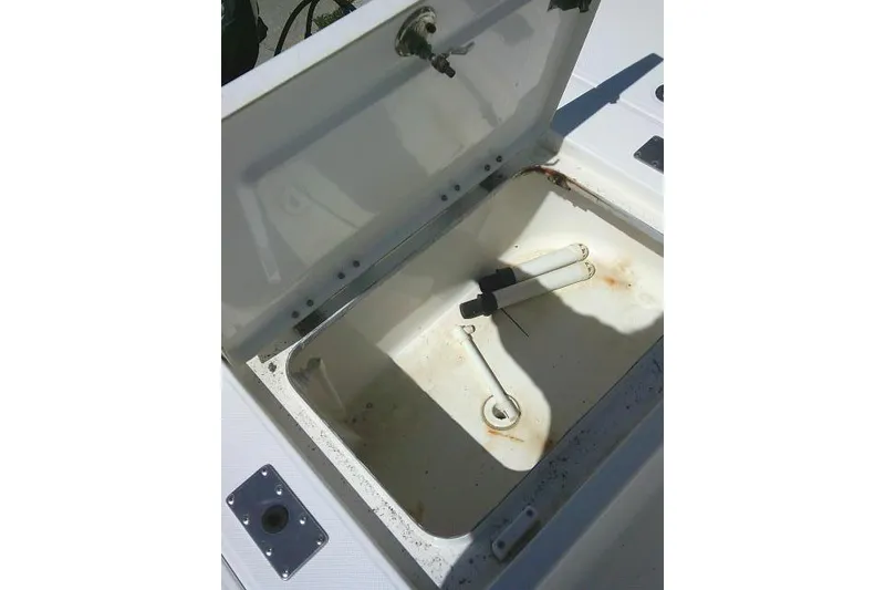 Slide: The Image of Open storage compartment on a 2005 Century 2201 Bay Boat, showing interior details. - 26