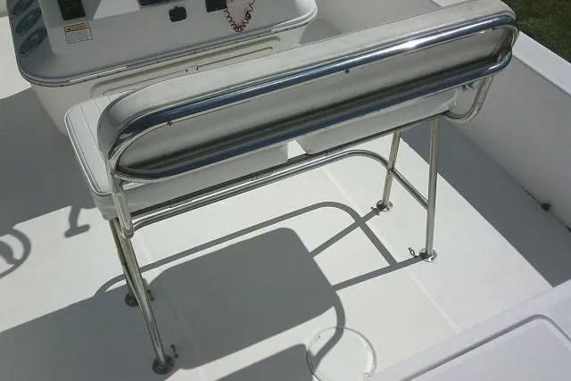 Slide: The Image of 2005 Century 2201 Bay Boat interior with stainless steel seating and console. - 28