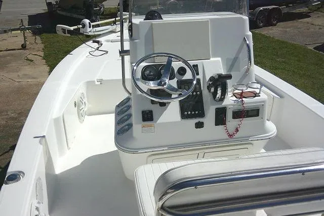 Slide: The Image of 2005 Century 2201 Bay Boat interior with steering console and seating. - 29
