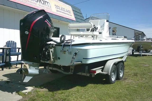 Slide: The Image of 2005 Century 2201 Bay Boat on trailer, parked outdoors near a building. - 3