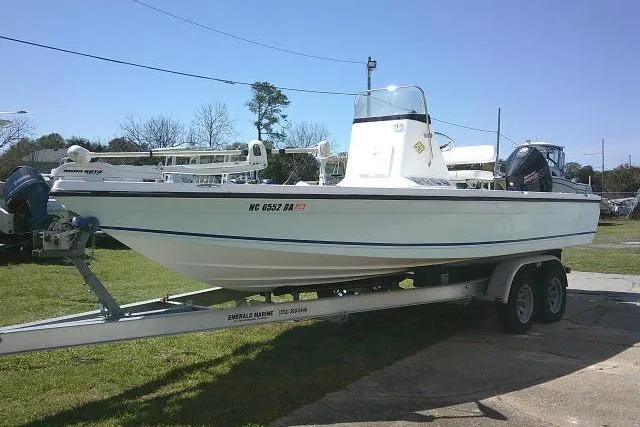 Slide: The Image of 2005 Century 2201 Bay Boat on trailer, parked outdoors on grass. - 9