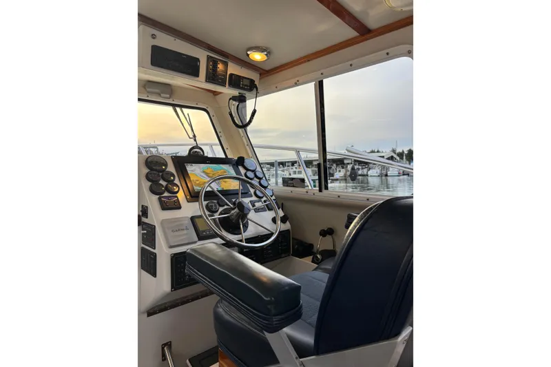 Slide: The Image of Interior view of 2005 Ocean Sport Roamer #12 boat cockpit with navigation equipment. - 4