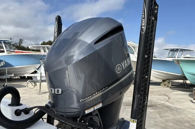 Slide: The Image of Yamaha outboard motor on 2020 Islamorada 24 Morada boat, docked with other boats. - 11