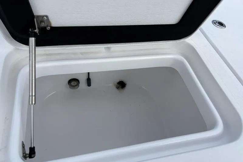 Slide: The Image of Open storage compartment on a 2020 Islamorada 24 Morada boat. - 19
