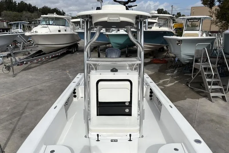 Slide: The Image of 2020 Islamorada 24 Morada boat in marina, surrounded by other vessels. - 23