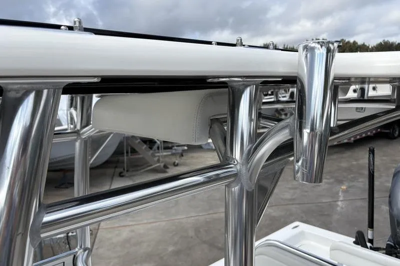 Slide: The Image of Close-up of 2020 Islamorada 24 Morada boat's polished metal framework and rod holder. - 24