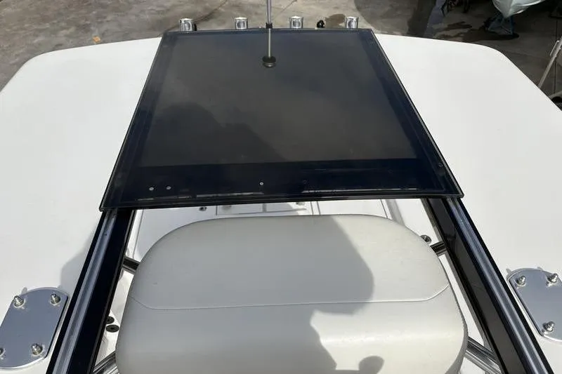 Slide: The Image of 2020 Islamorada 24 Morada boat console with seating and navigation panel. - 20
