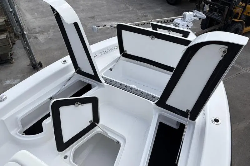 Slide: The Image of 2020 Islamorada 24 Morada boat with open storage compartments on deck. - 22