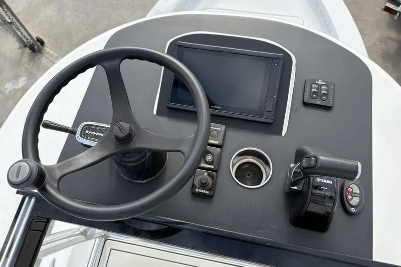 Slide: The Image of Helm of 2020 Islamorada 24 Morada boat with steering wheel and controls. - 29