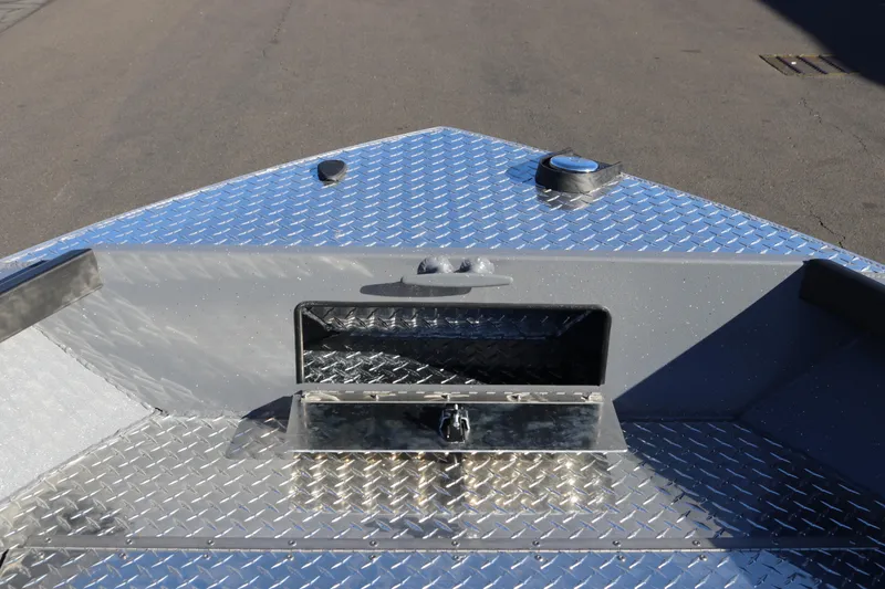 Slide: The Image of Alumaweld Super Vee 20 boat deck, 2026 model, featuring diamond plate aluminum surface. - 16