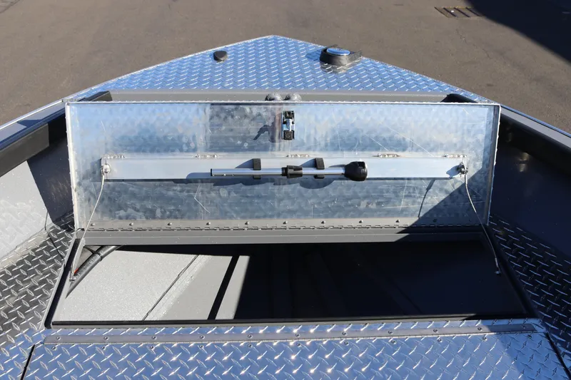 Slide: The Image of 2026 Alumaweld Super Vee 20 boat with open storage compartment on diamond plate deck. - 17