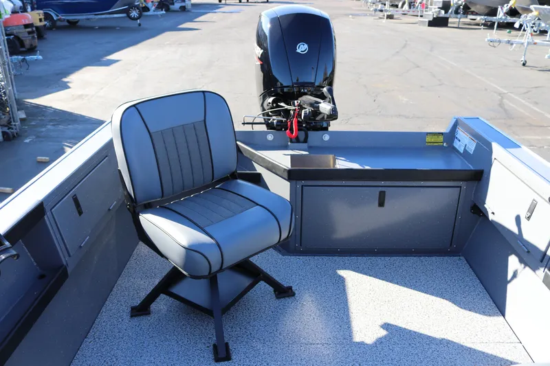 Slide: The Image of 2026 Alumaweld Super Vee 20 boat interior with seating and motor. - 24