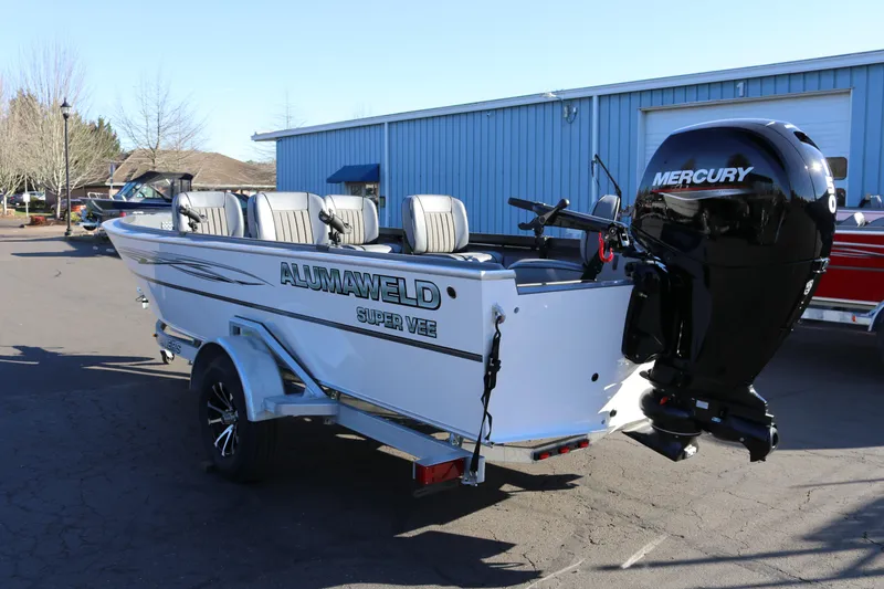 Slide: The Image of 2026 Alumaweld Super Vee 20 boat with Mercury outboard motor in a parking lot. - 3