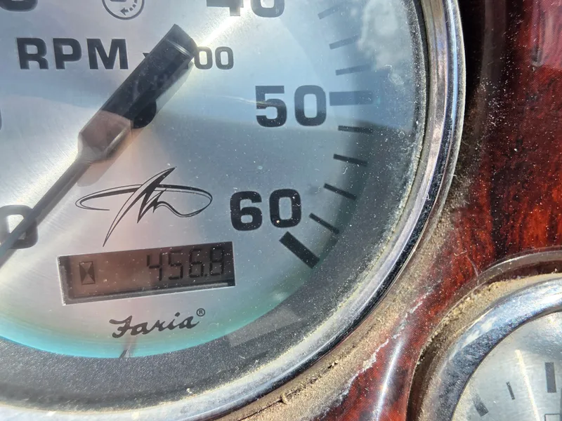 Slide: The Image of Close-up of a tachometer reading 456.6 hours on a Monterey 208SI Montura. - 11