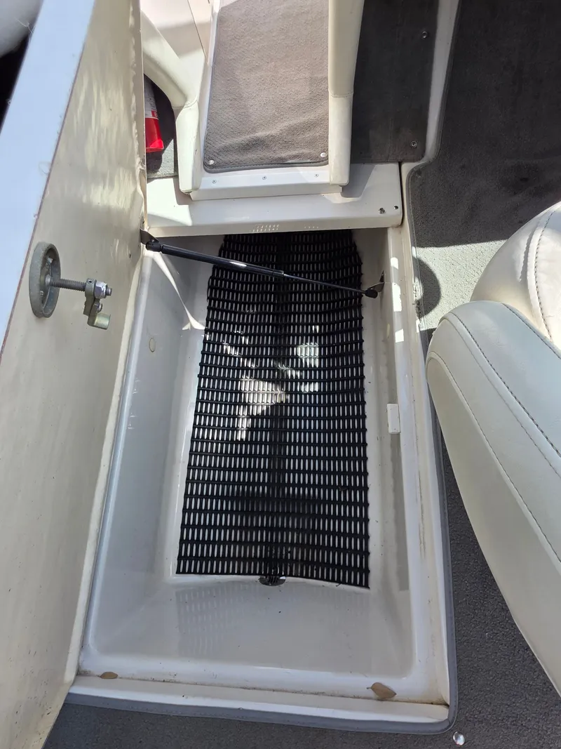 Slide: The Image of Storage compartment in 2003 Monterey 208SI Montura boat. - 12