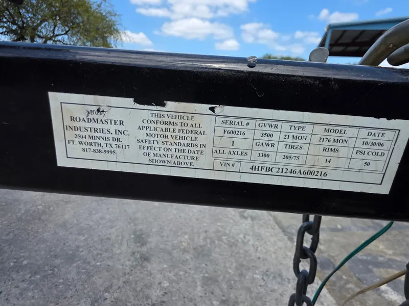 Slide: The Image of Roadmaster Industries vehicle label with specifications and serial number. - 13