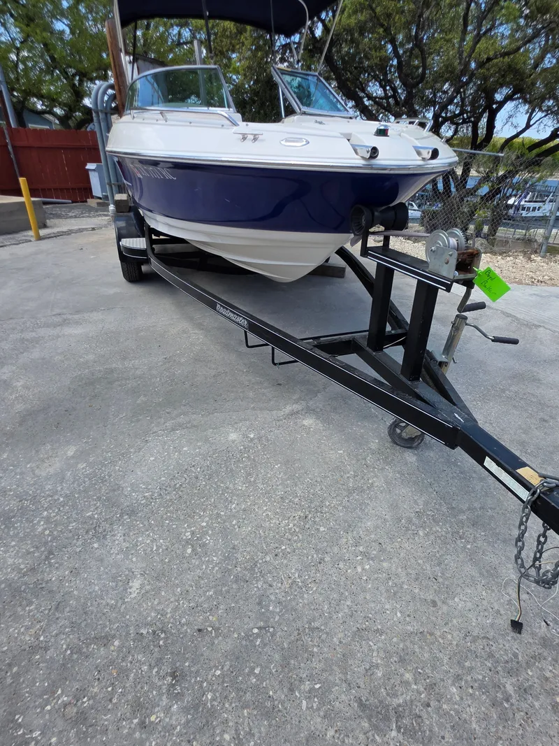 Slide: The Image of 2003 Monterey 208SI Montura boat on trailer, blue and white. - 14