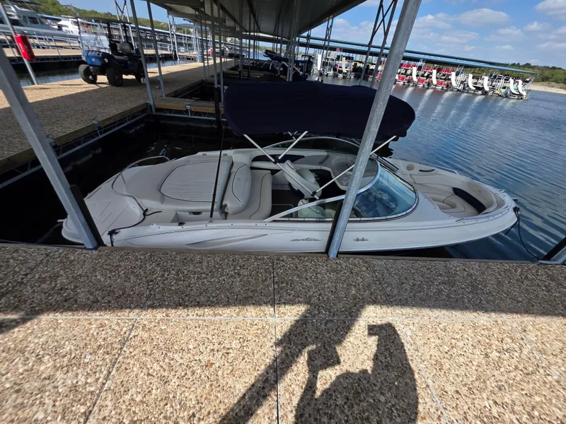 Slide: The Image of 2003 Monterey 208SI Montura boat docked, side view. - 17