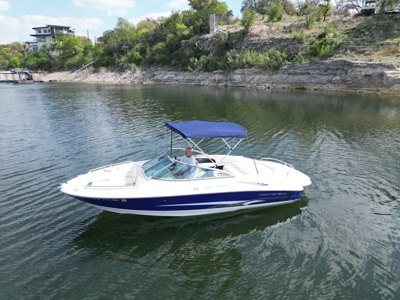 Slide: The Image of 2003 Monterey 208SI Montura boat on calm lake. - 20