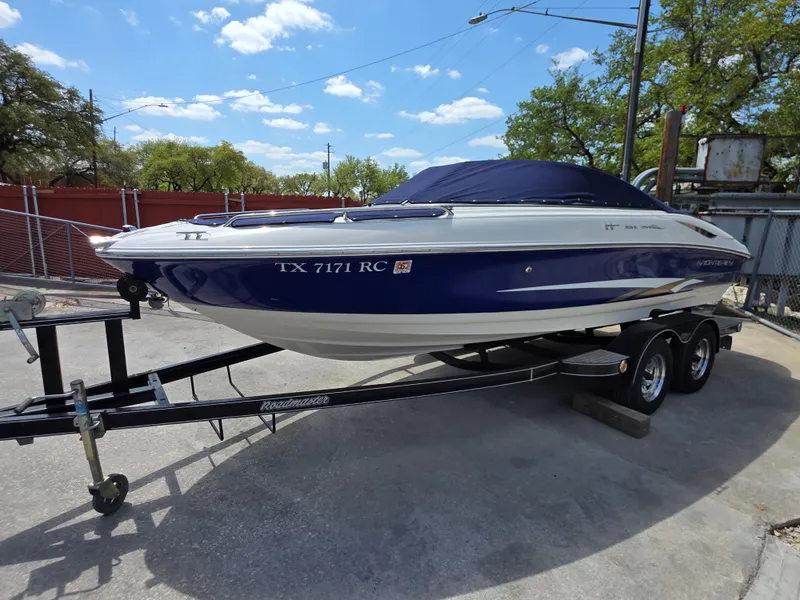 Slide: The Image of 2003 Monterey 208SI Montura boat on trailer, blue sky. - 5