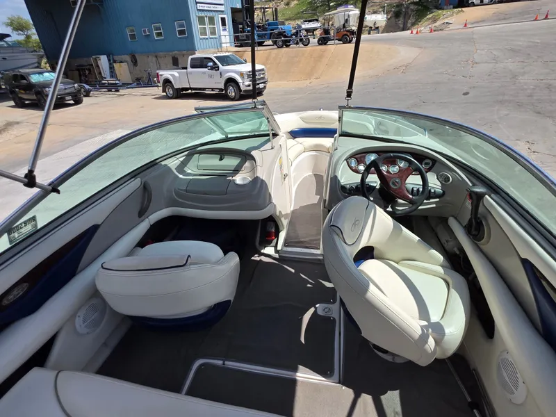 Slide: The Image of Interior of a 2003 Monterey 208SI Montura boat with white leather seats. - 9