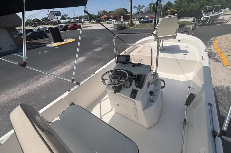 Slide: The Image of 2020 Carolina Skiff 192 JLS boat interior with steering console and seating. - 13