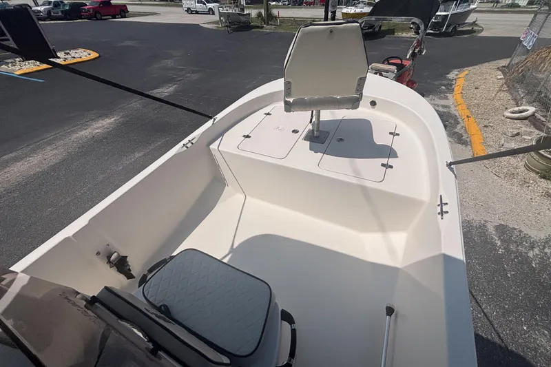 Slide: The Image of 2020 Carolina Skiff 192 JLS boat interior with seating and storage compartments. - 15