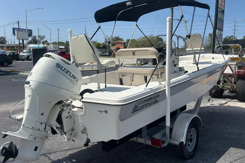 Slide: The Image of 2020 Carolina Skiff 192 JLS boat with Suzuki outboard motor on trailer. - 5
