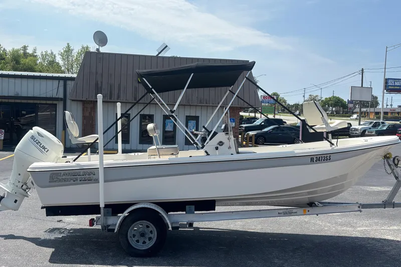 Slide: The Image of 2020 Carolina Skiff 192 JLS boat on trailer with Suzuki outboard motor. - 6