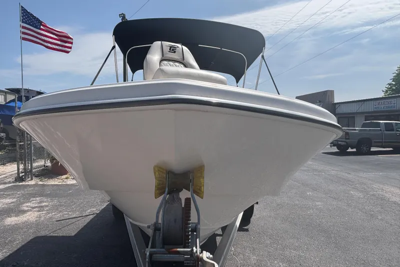 Slide: The Image of 2020 Carolina Skiff 192 JLS boat on trailer, American flag in background. - 8