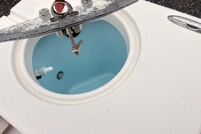 Slide: The Image of Livewell on 2023 Sea Born LX26 Center Console boat, open lid view. - 10