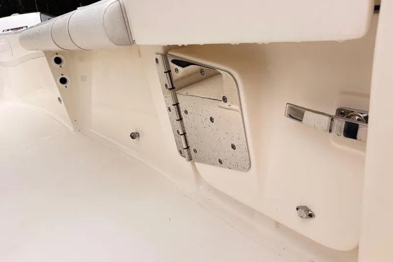 Slide: The Image of 2023 Sea Born LX26 Center Console boat interior detail with stainless steel hardware. - 12