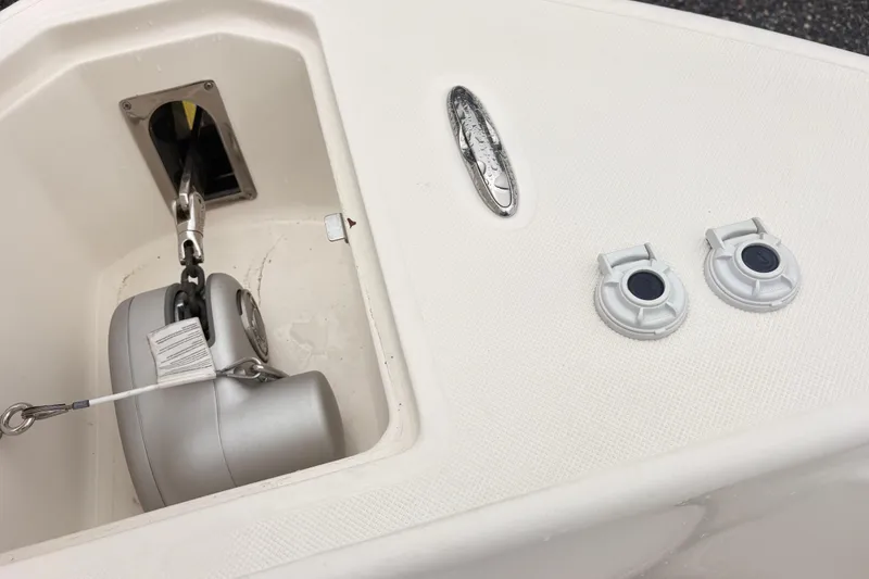 Slide: The Image of 2023 Sea Born LX26 Center Console boat anchor compartment and deck fittings. - 16